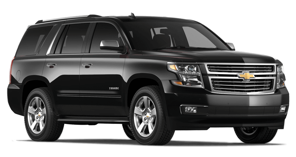 SUV grande Chevrolet Tahoe color negro vista frontal tres cuartos sobre fondo blanco